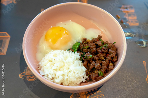 Rice topped with stir-fried beef and basil with fried egg. Thailand tradiotional food. asian crusine. photo