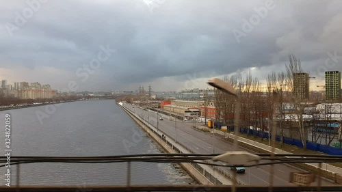 City landscape with a river. View from the train from Nagatinsky bridge. Moscow, Russia photo