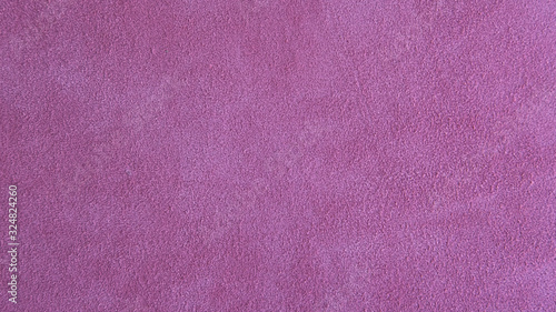 Lilac pink suede leather background with neat texture and copy space, fuzzy leather with a napped finish, showing softness and pliability, fabric sample for sewing, upholstery, shoes or bags making