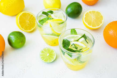 Citrus cold lemonade with lime, mint and lemons in glasses © artifirsov