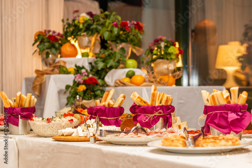 Catering buffet table with cold snacks. Delicious appetizers on the table, self serve.