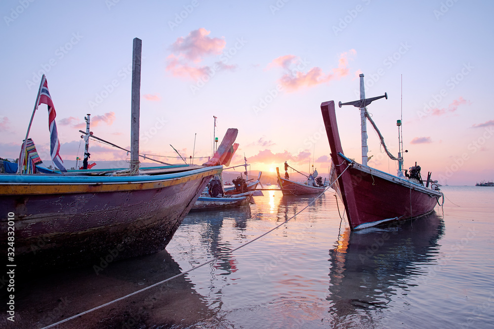 Beautiful sunset on the sea with traditional thai longtail boat. Beautiful sunset on the sea with traditional thai longtail boat.