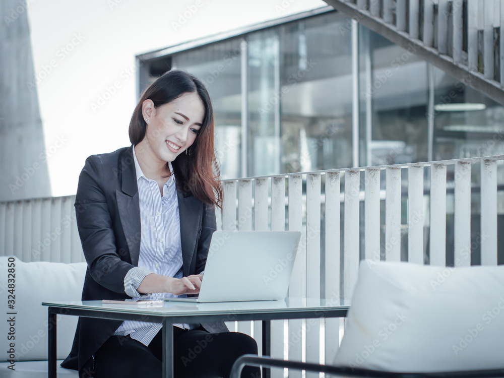 Asian business woman with laptop happy and smile concept success work Asian business woman with laptop happy and smile concept success work
