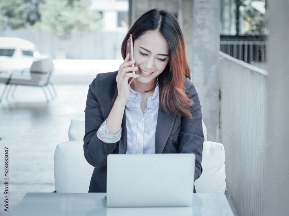 Asian business woman with laptop happy and smile concept success work Asian business woman with laptop happy and smile concept success work