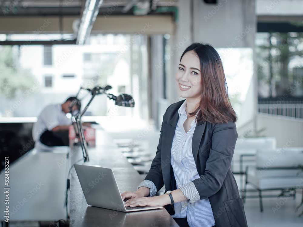 Obraz premium Asian business woman with laptop happy and smile concept success work