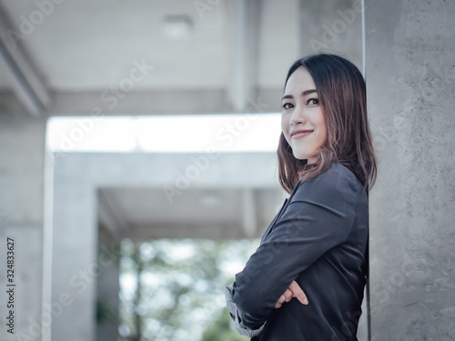 Asian business woman with laptop happy and smile concept success work