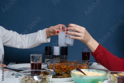 Turkish and Greek Traditional Dinning Table with Special Alcohol Drink Raki. Ouzo and Turkish Raki is a dry anise flavoured aperitif that is widely consumed in Turkey, Greece, Cyprus and Lebanon photo