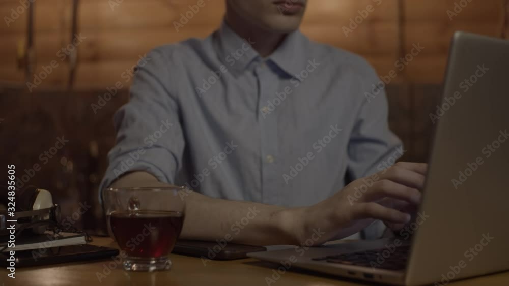 Young man working with laptop, slow motion Young man working with laptop, slow motion