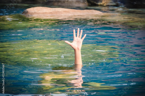 The man's hand and asked for help from drowning in the pool