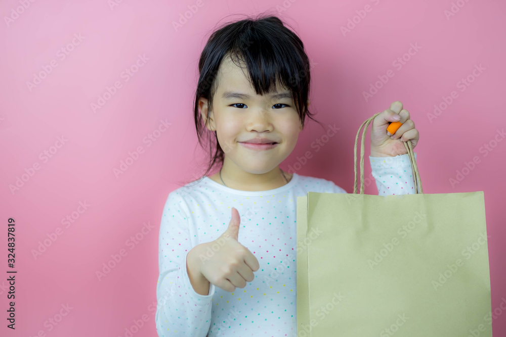 Portrait of cute little girl with shopping bag Portrait of cute little girl with shopping bag