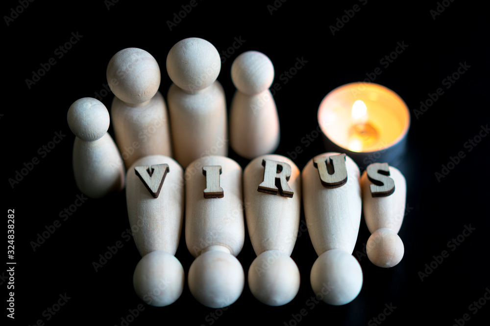 The concept of memory of the dead from the virus. Figures of the dead from a virus on a black background. close up The concept of memory of the dead from the virus. Figures of the dead from a virus on a black background. close up
