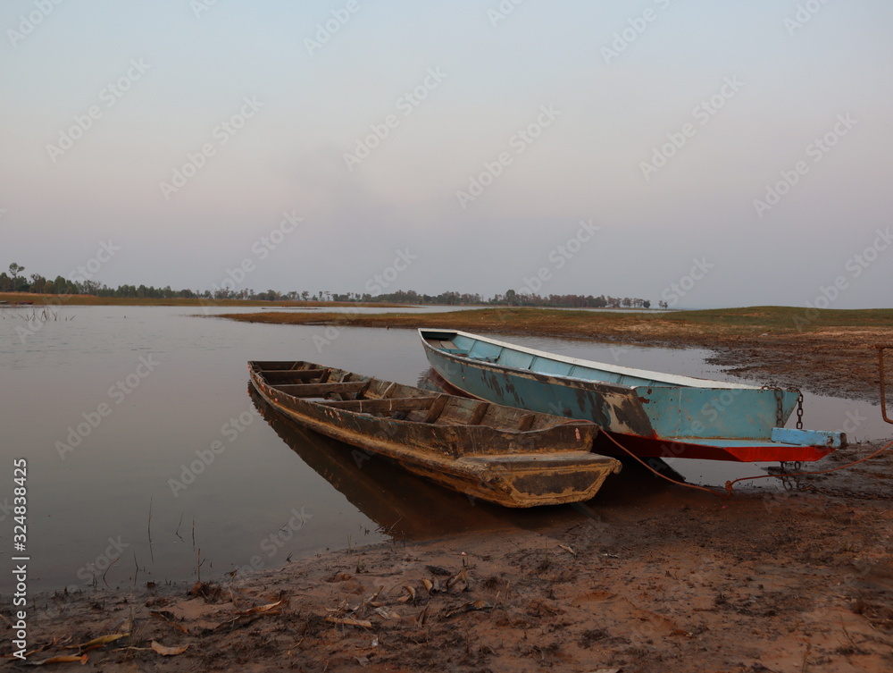 Two boats tied at the bank of the river