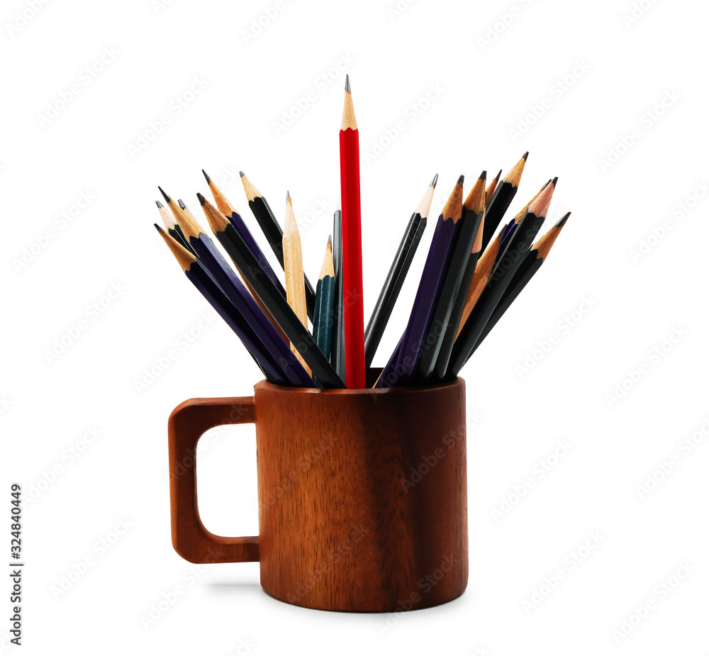 Red sharp pencil stand out from crowd of other pencils in the wooden cup on white background ,represent leadership ,different ,unique ,independent and winner concept Red sharp pencil stand out from crowd of other pencils in the wooden cup on white background ,represent leadership ,different ,unique ,independent and winner concept