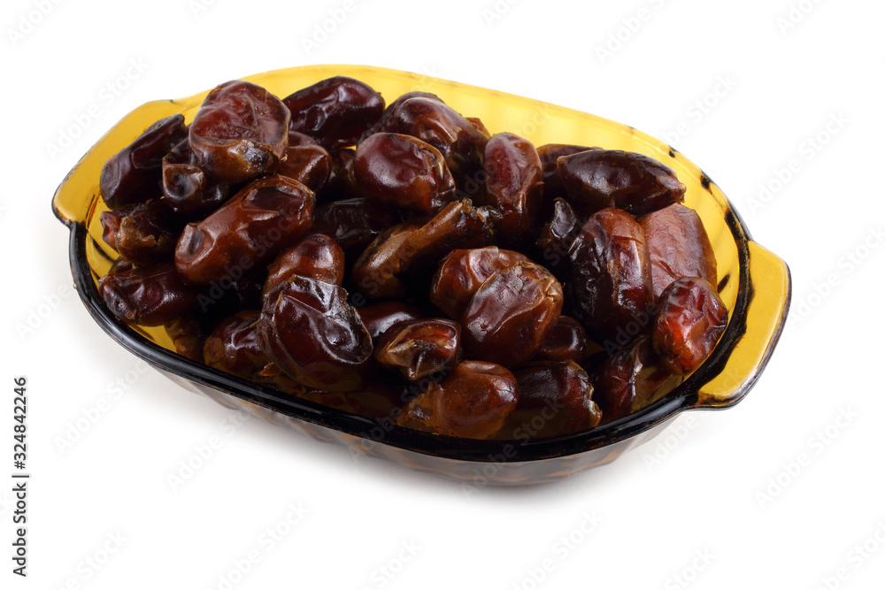 Date fruits on plate isolated on white Date fruits on plate isolated on white