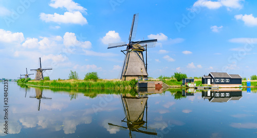 Panorama of the windmills and the reflection on water in Kinderdijk, a UNESCO World Heritage site in Rotterdam, Netherlands