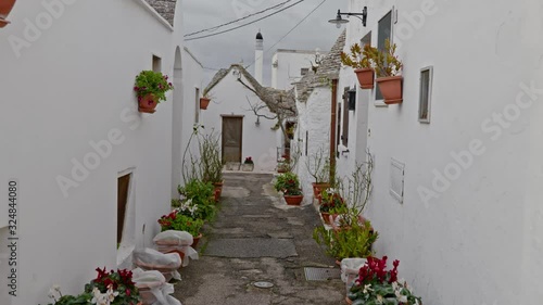 Walking streets of trulli town Alberobello, Italy