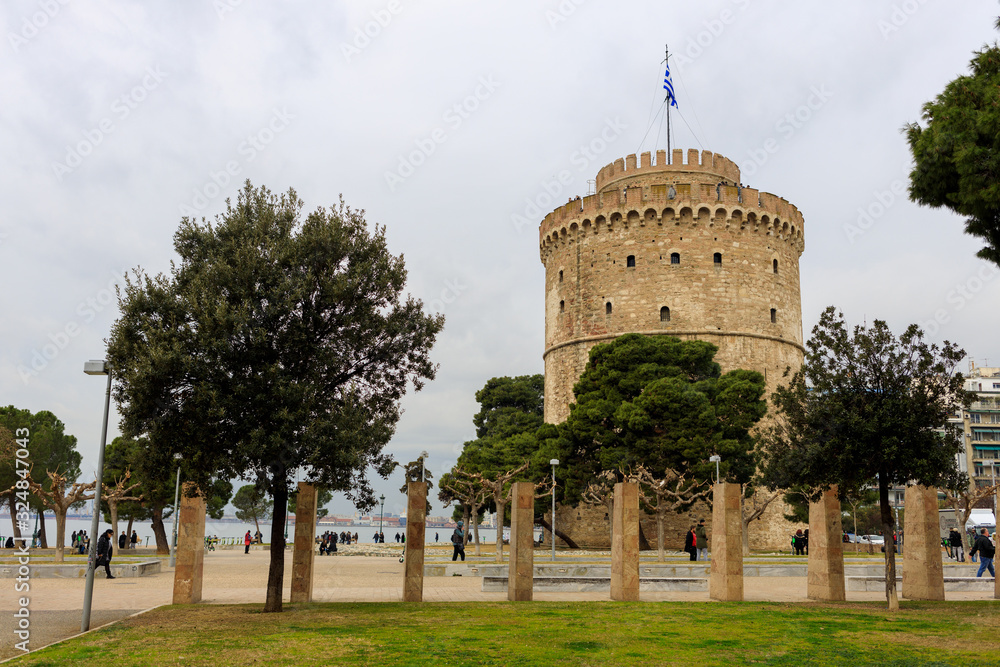 Thessaloniki, Greece - February 12 2020: White Tower, promenade in the afternoon