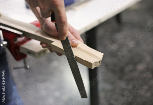 instrument making - close up of a man making musical instruments - traditional greek baglamas - a plucked string instrument in Greece  photo