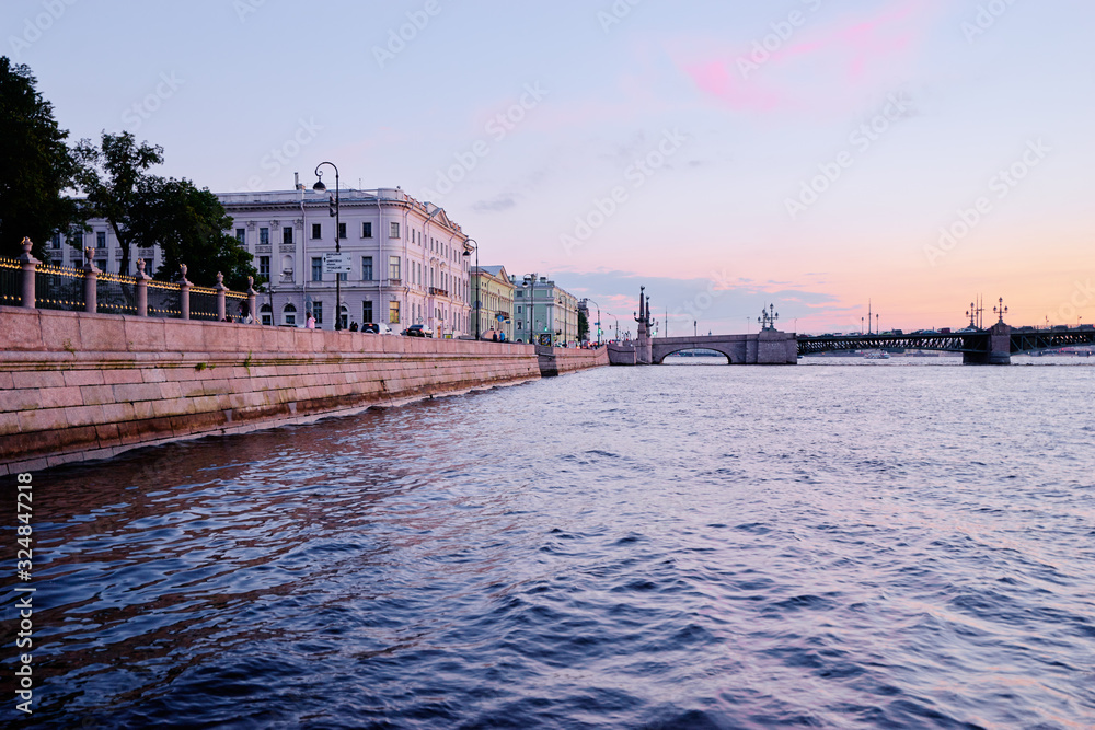 Sunset cityscape. Embankment on Neva river in Saint-Petersburg, Russia.
