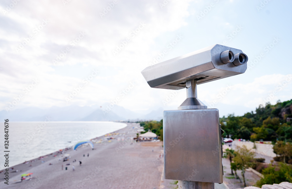 Coin Operated Binocular viewer next to the waterside promenade in Antalya looking out to the bay and city.