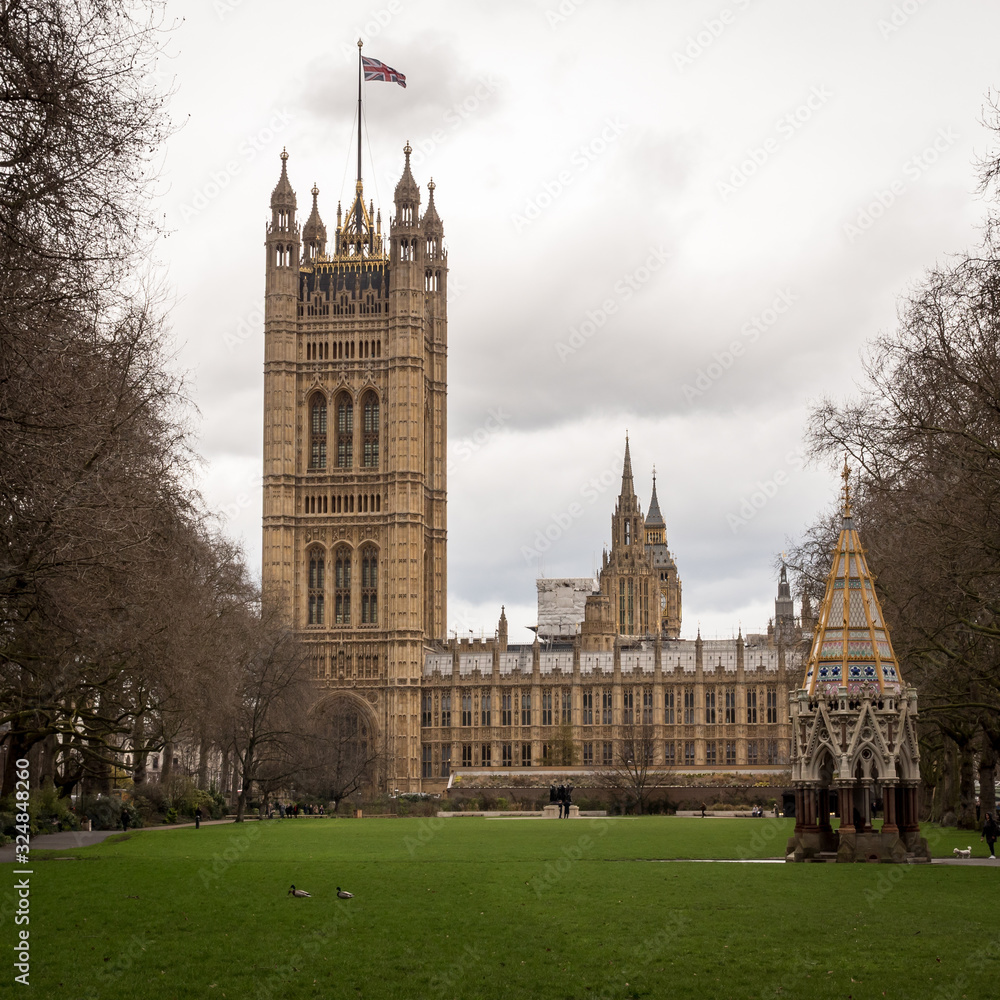 Fototapeta premium Palace of Westminster, London. A view from Victoria Tower Gardens looking towards The Houses of Parliament, the seat of UK politics and government.
