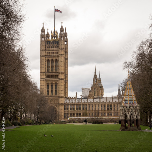 Palace of Westminster, London. A view from Victoria Tower Gardens looking towards The Houses of Parliament, the seat of UK politics and government. photo