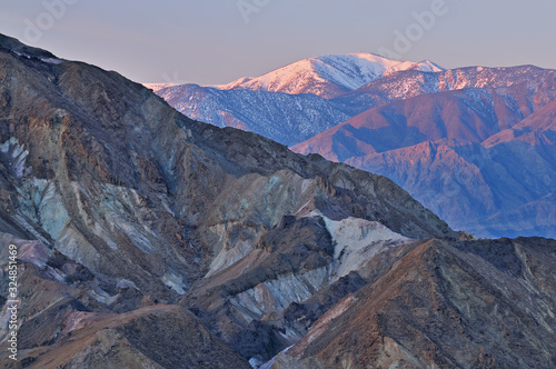 Fototapeta Naklejka Na Ścianę i Meble -  Landscape at sunrise, Golden Canyon and Panamint Mountains from Zabriskie Overlook, Death Valley National Park, California, USA