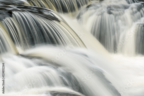 Landscape of Bond Falls cascade captured with motion blur, Michigan's Upper Peninsula, USA