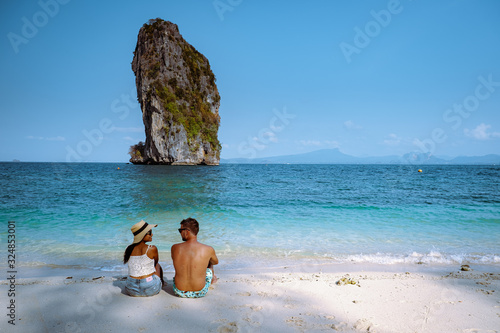 couple men and woman on the ebach, Koh Poda Krabi Thailand, white beach with crystal clear water in Krabi Thailand photo