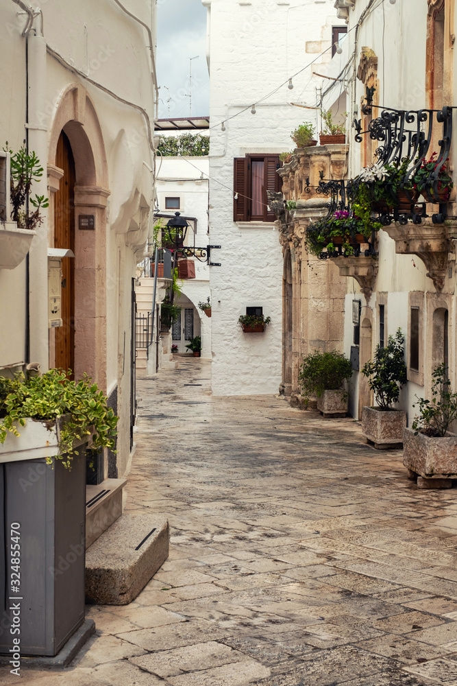 Walking charming white streets of Locorotondo in Puglia, Italy