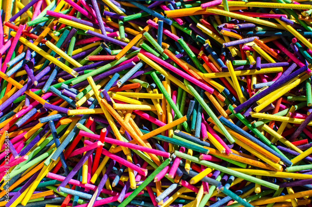 Background of colored sticks create an origami of cheerful and colorful colors.