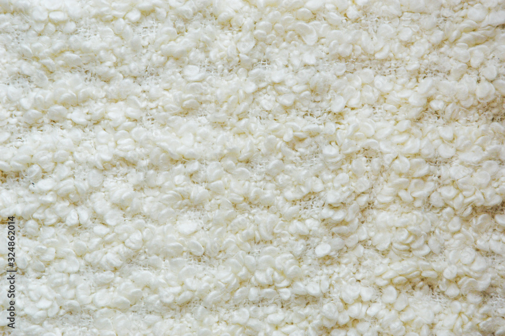 White wool blanket. Beautiful white texture. Knitted blanket. White wool blanket. Beautiful white texture. Knitted blanket.