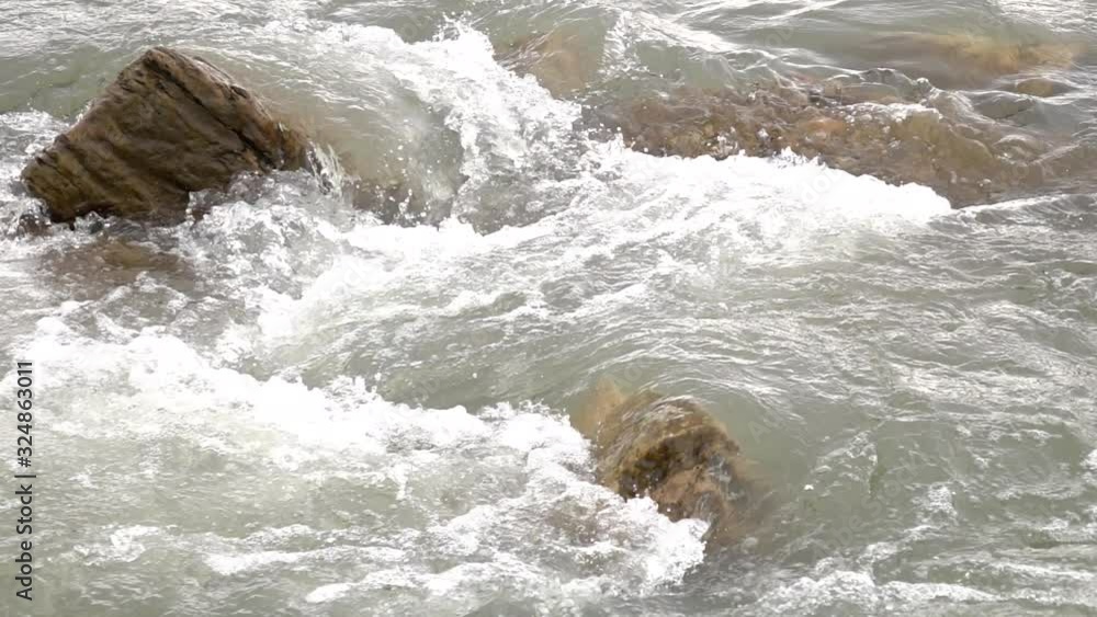 Rapids of a mountain river, slow motion Rapids of a mountain river, slow motion