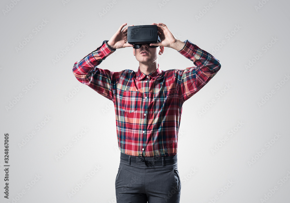 Guy in mask experiencing virtual reality as new entertainment device Guy in mask experiencing virtual reality as new entertainment device