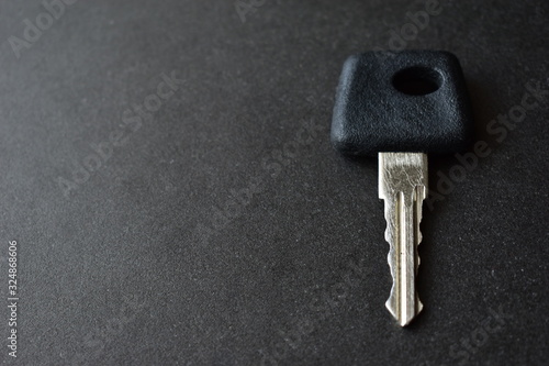 One car key on a black background © Lushchikov Valeriy