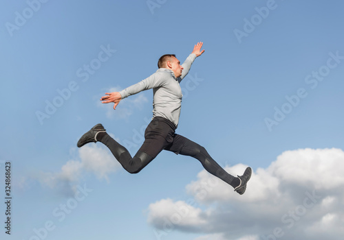 Portrait of athletic man jumping