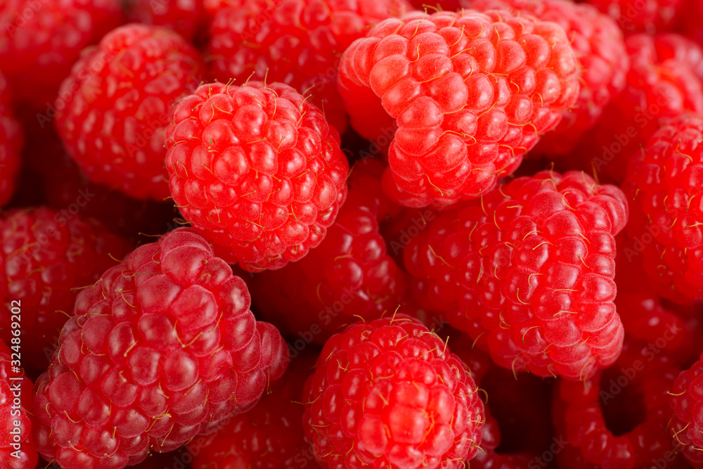 Macro shot of freshly picked organic raspberries. High resolution Macro shot of freshly picked organic raspberries. High resolution