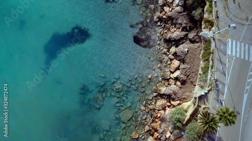 Waves are washing on stones and pebbles on the shore 4. Slow motion.