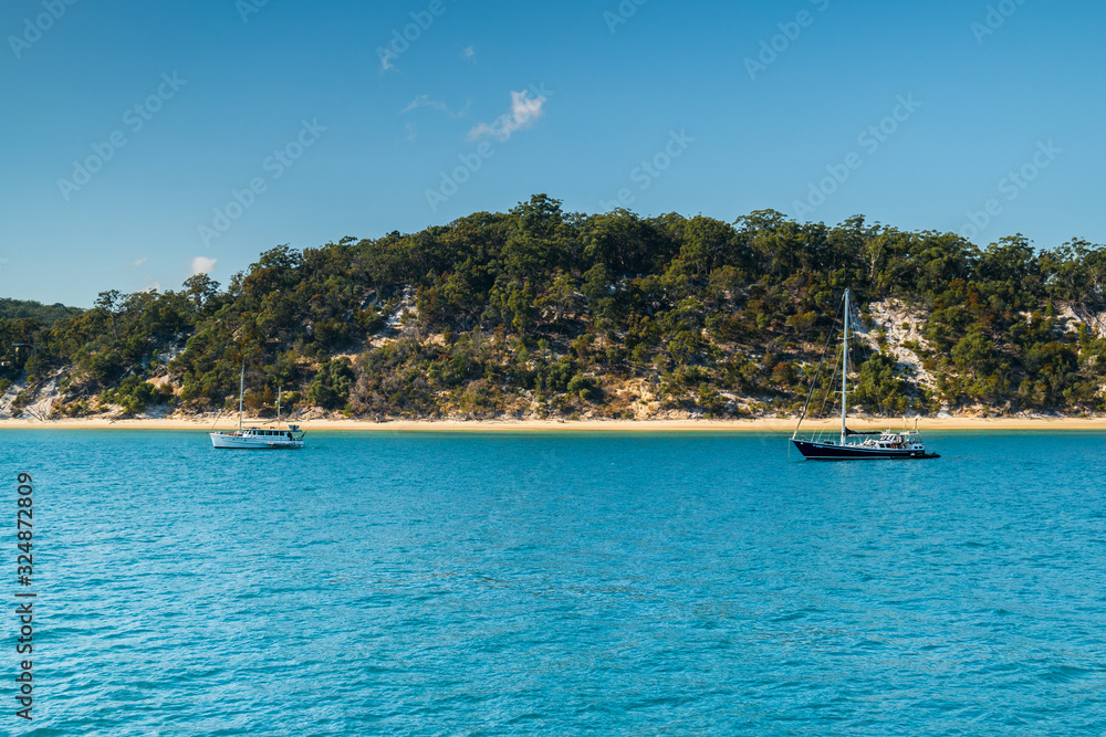 Yachts in turqoise water Fraser Island tropical Australia