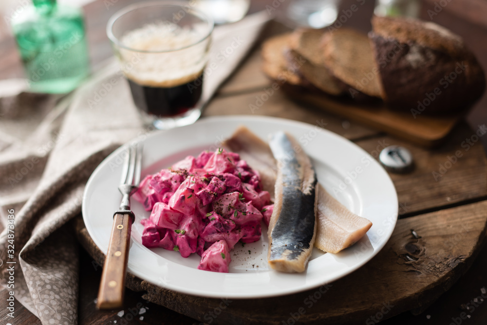 Homemade Beet and Potato Salad Served with Salted Herring Fillet