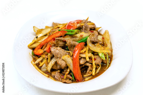 Stir-fried beef with bamboo shoots in white plate on white background, Close up.