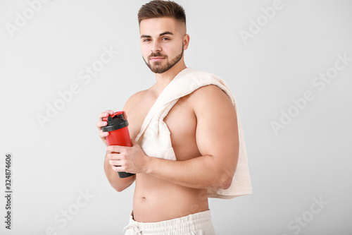 Sporty man with protein sha...
