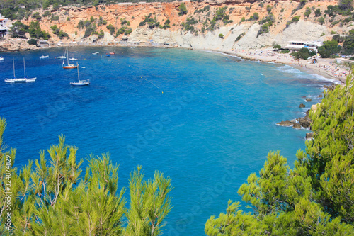 the blue sea of ​​ibiza in summer and its bright colors between water and beaches in the coves