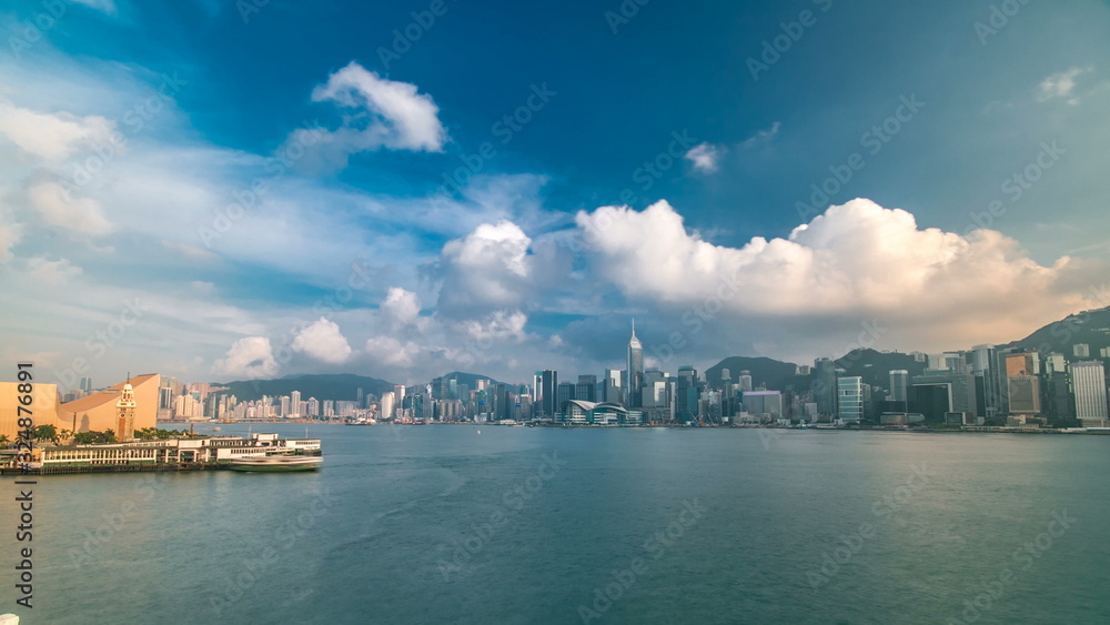 Hong Kong Harbor panorama cityscape timelapse - Central District, Victoria Harbor, Victoria Peak, Hong Kong Island and Kowloon, Hong Kong. Hong Kong Harbor panorama cityscape timelapse - Central District, Victoria Harbor, Victoria Peak, Hong Kong Island and Kowloon, Hong Kong.