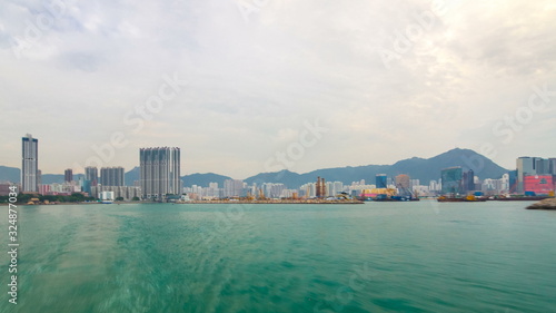 View from Star Ferry through Victoria Harbour timelapse hyperlapse, with the skyline of Hong Kong as backdrop © neiezhmakov