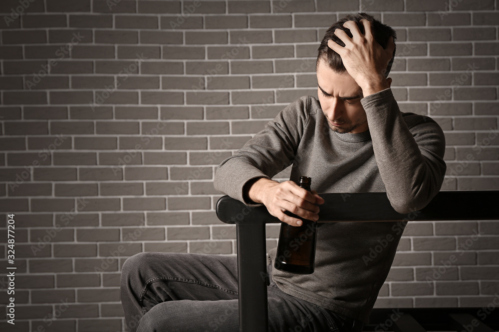 Portrait of depressed young man indoors Portrait of depressed young man indoors