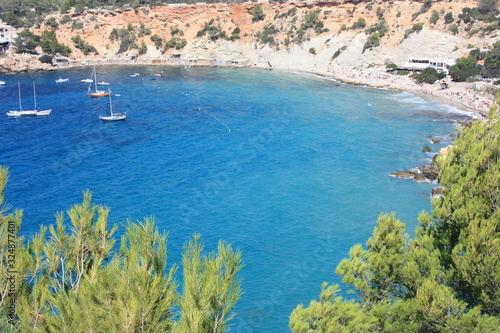 the blue sea of ​​ibiza in summer and its bright colors between water and beaches in the coves