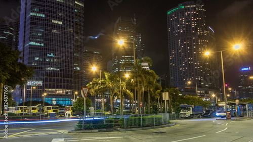 Night view hyperlapse of modern city traffic across street with skyscrapers. Time lapse. Hong Kong