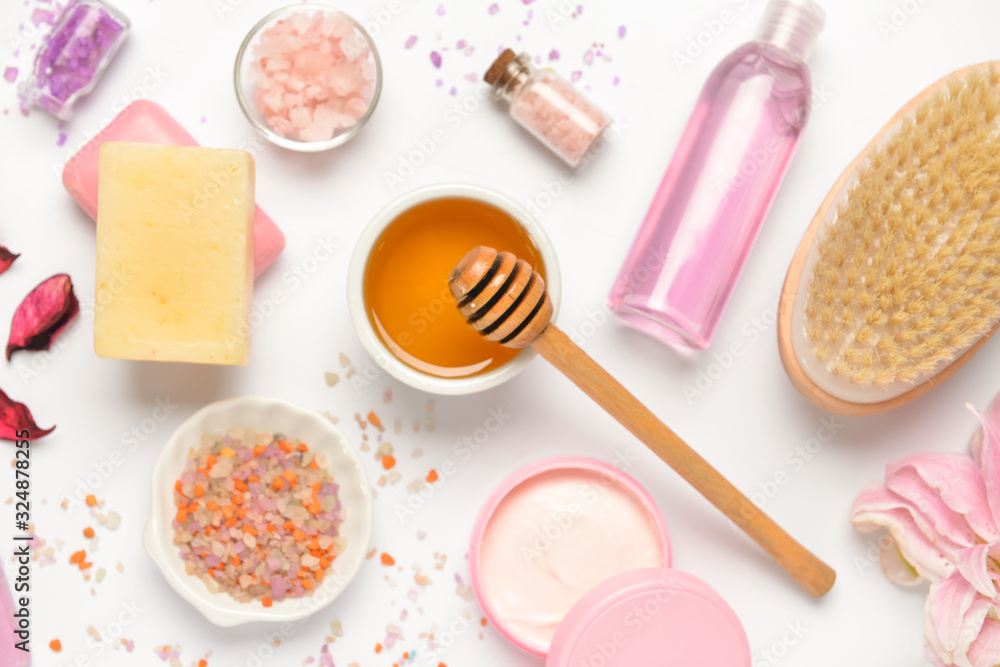 Composition with spa items and honey on white background Composition with spa items and honey on white background