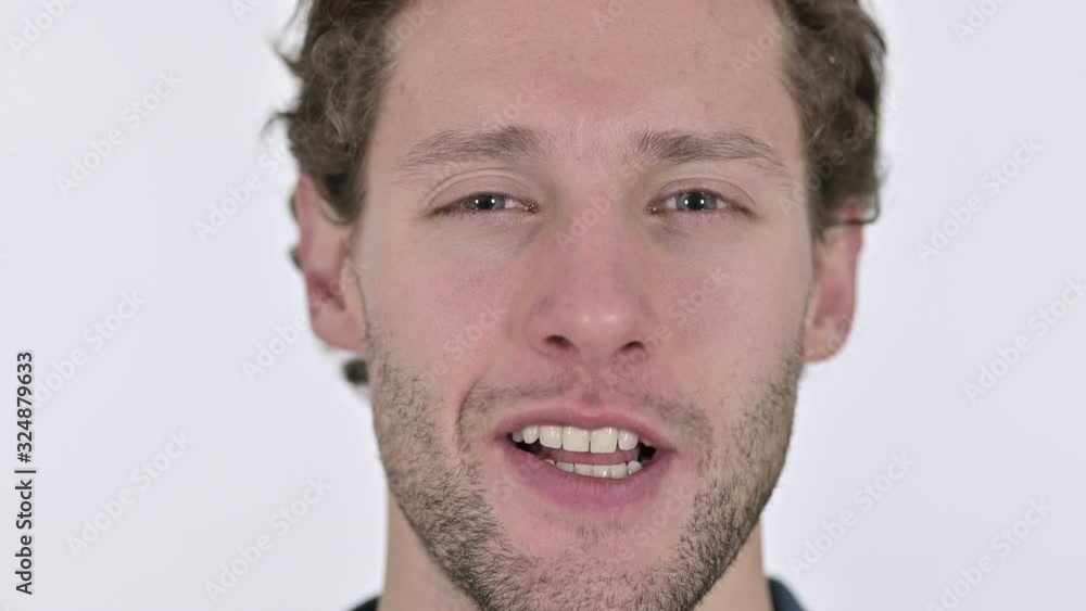 Close up of Smiling Young Man Face on White Background Close up of Smiling Young Man Face on White Background